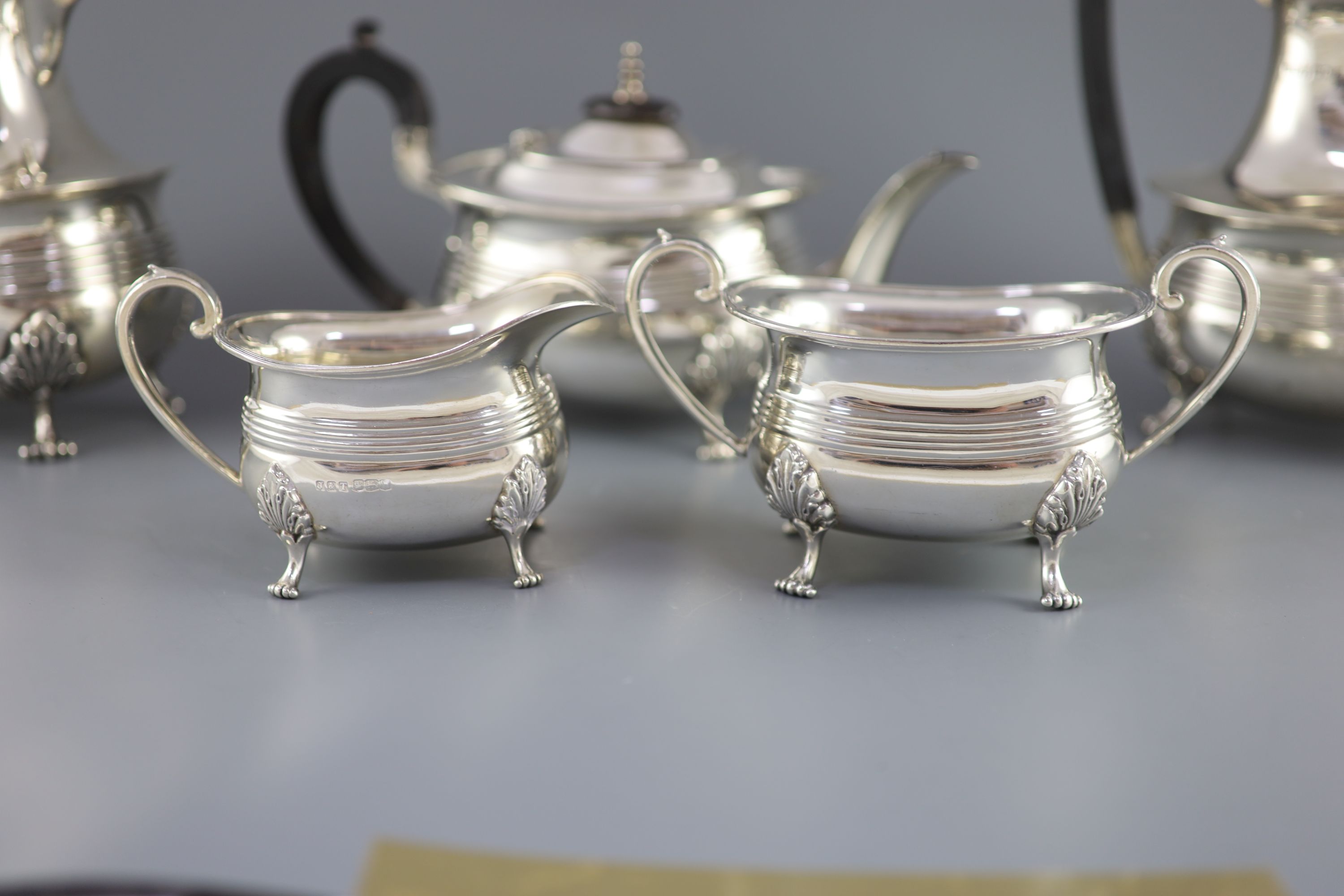 A matched silver five-piece tea service of reeded oval form, Jenkins & Timm, Sheffield 1922-3 and 1925